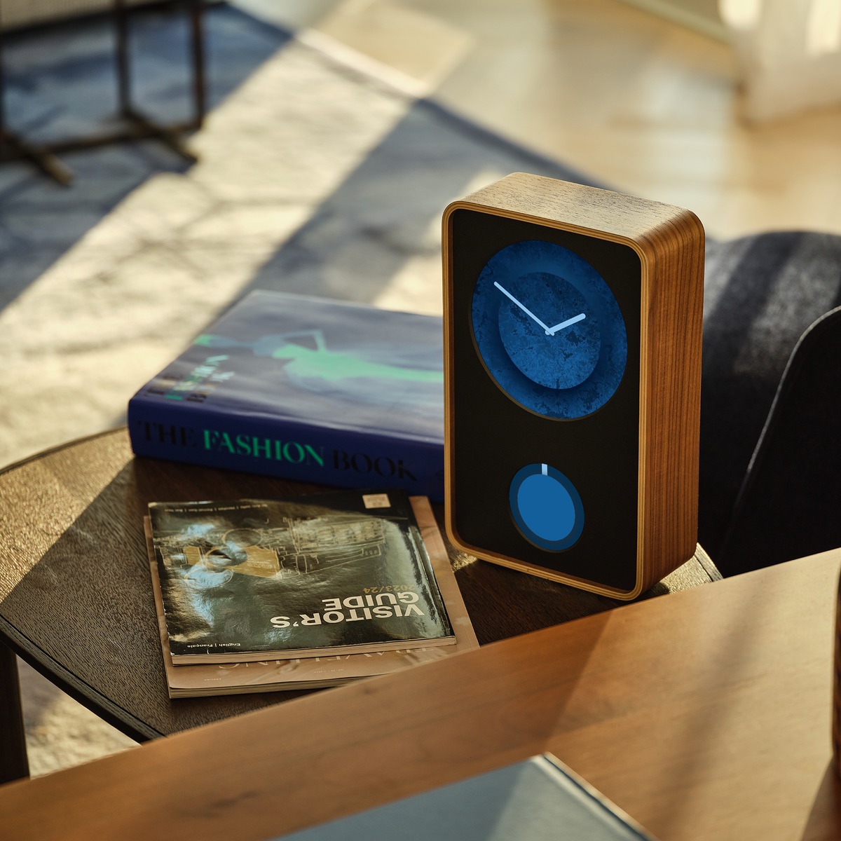 Klydoclock with blue textured artwork and a wood case